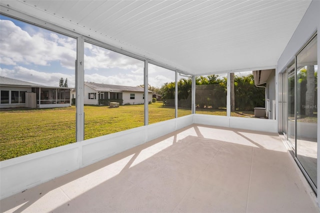 unfurnished sunroom with a wealth of natural light