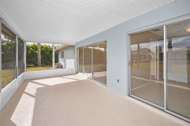 unfurnished sunroom featuring a wealth of natural light