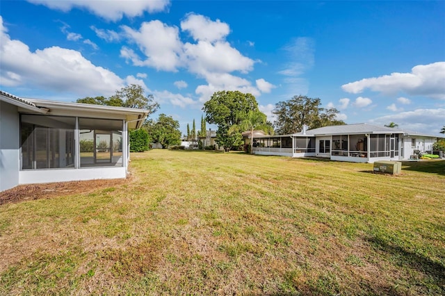 view of yard with a sunroom