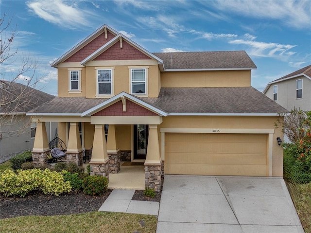 craftsman house featuring a garage and covered porch