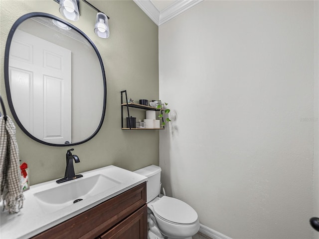 bathroom featuring vanity, toilet, and ornamental molding