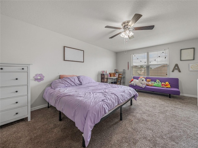 carpeted bedroom featuring a textured ceiling and ceiling fan