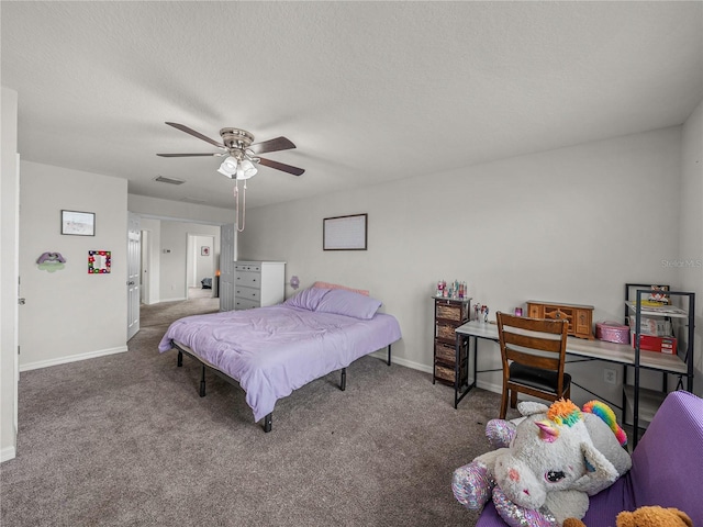 carpeted bedroom with ceiling fan and a textured ceiling