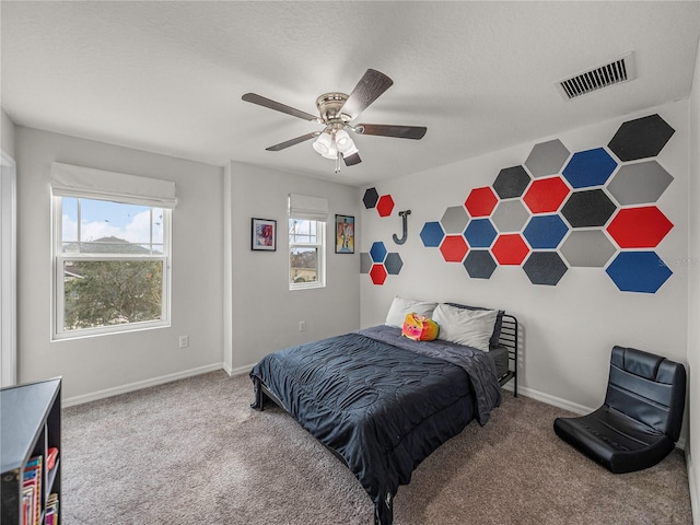 carpeted bedroom with ceiling fan