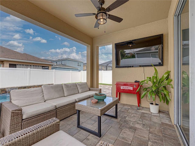 view of patio with ceiling fan and an outdoor hangout area