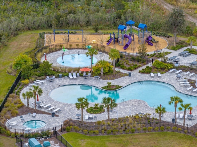 view of pool featuring a playground