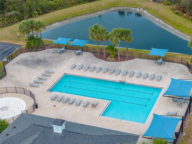 view of swimming pool with a water view