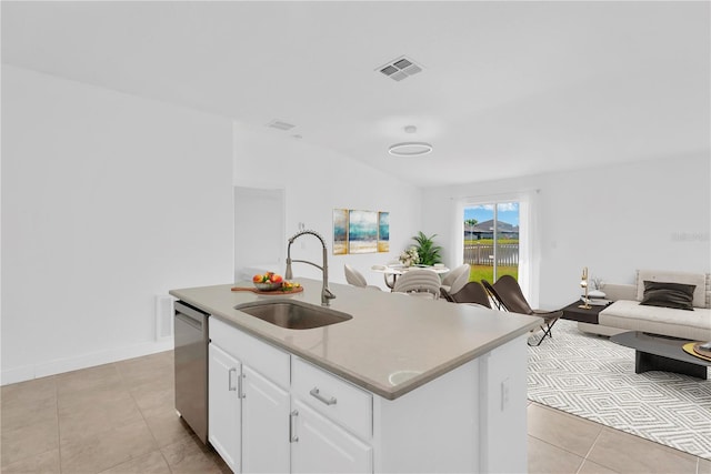 kitchen with sink, vaulted ceiling, dishwasher, a kitchen island with sink, and white cabinets