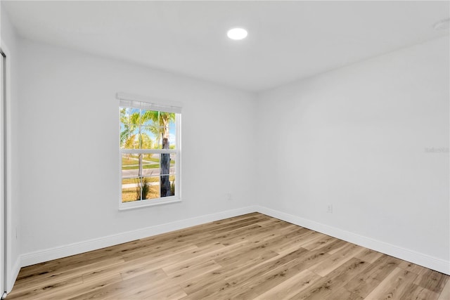 spare room featuring light hardwood / wood-style flooring