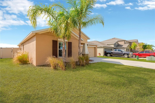 view of front of house with a garage and a front lawn