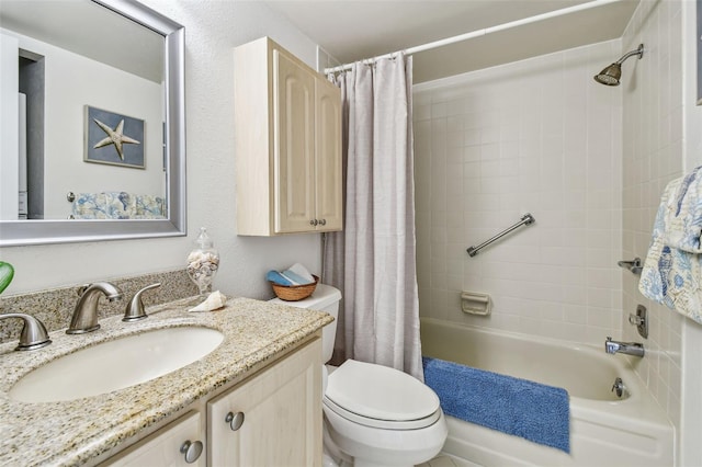 full bathroom featuring vanity, shower / tub combo, and toilet