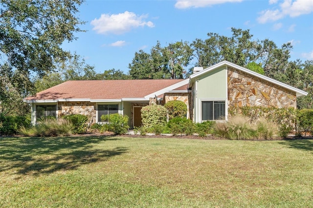 ranch-style house with a front yard