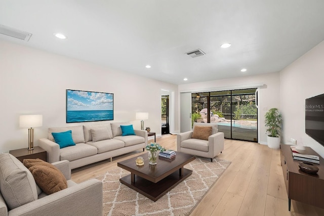 living room with light hardwood / wood-style floors