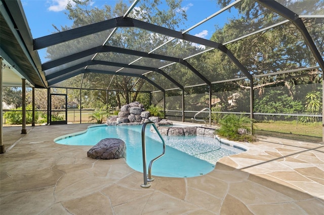 view of pool featuring a patio, pool water feature, and a lanai