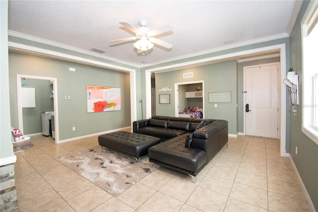 tiled living room featuring ceiling fan, ornamental molding, and a textured ceiling