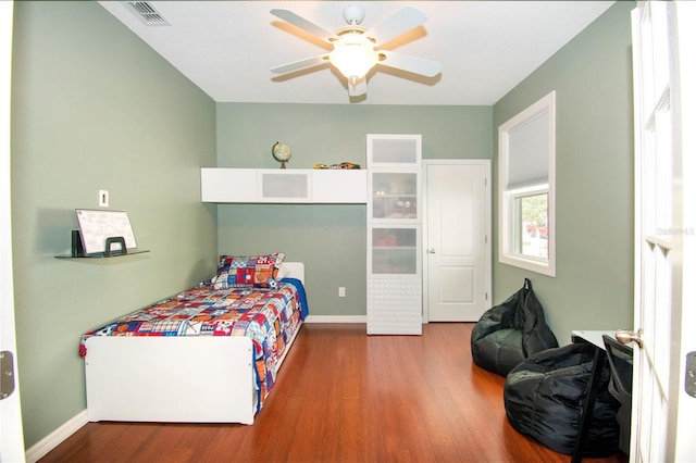 bedroom featuring ceiling fan and hardwood / wood-style flooring