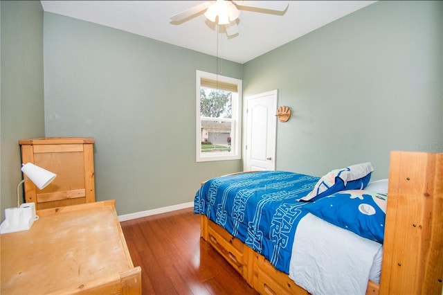 bedroom featuring dark hardwood / wood-style floors and ceiling fan