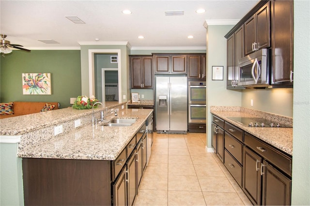 kitchen with ceiling fan, a spacious island, crown molding, and appliances with stainless steel finishes