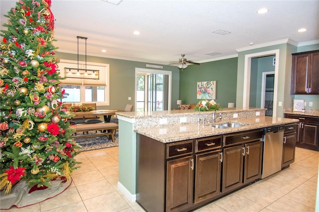 kitchen featuring dishwasher, dark brown cabinets, light tile patterned floors, and sink