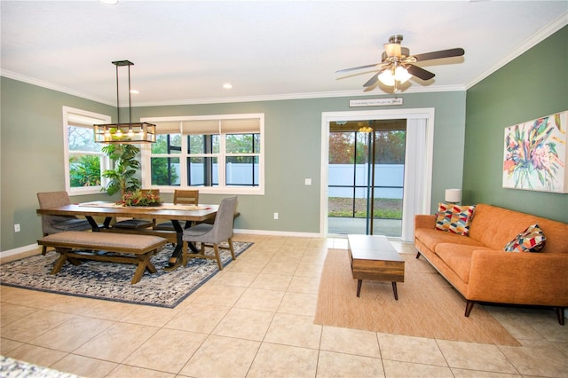 dining space featuring ceiling fan, ornamental molding, and light tile patterned floors