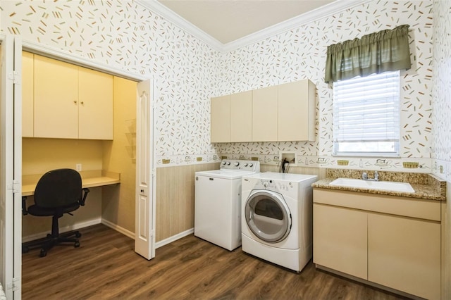 washroom featuring cabinets, dark hardwood / wood-style flooring, washer and clothes dryer, and sink