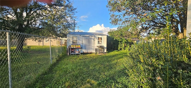 view of outbuilding with a lawn