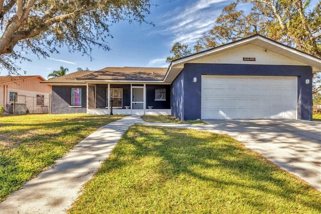 single story home featuring a garage and a front yard