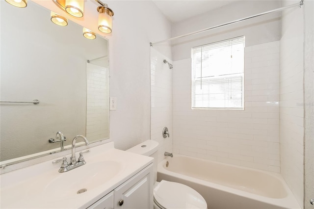 full bathroom featuring vanity, toilet, and tiled shower / bath