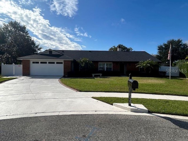 single story home featuring a front yard and a garage