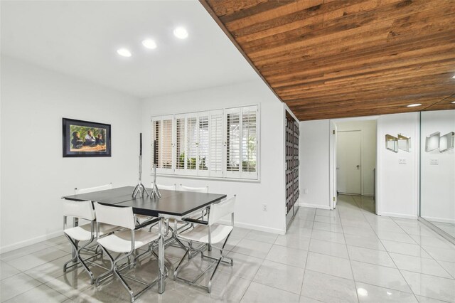 tiled dining area featuring wooden ceiling