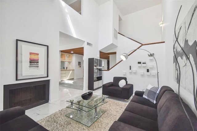 living room featuring a high ceiling