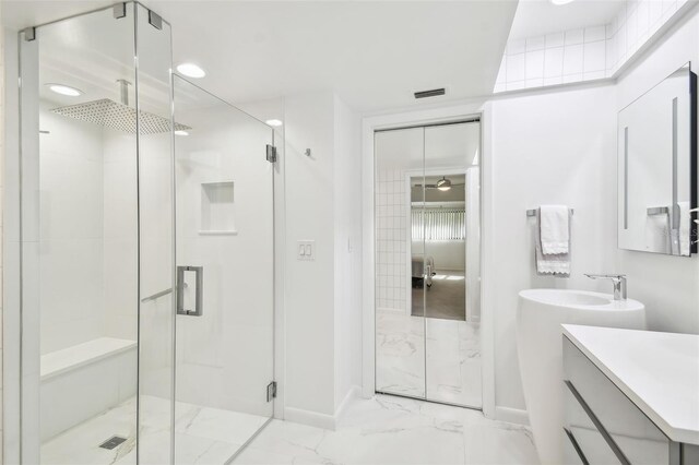 bathroom with vanity and walk in shower