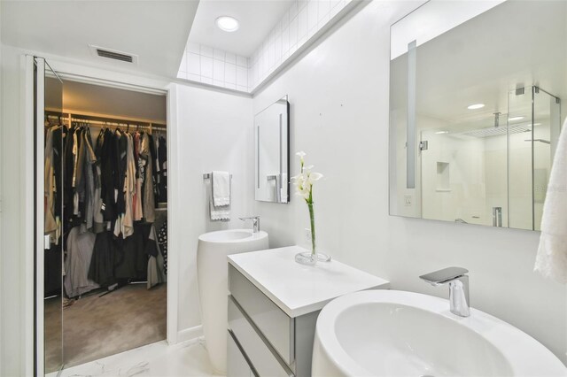 bathroom with vanity and walk in shower