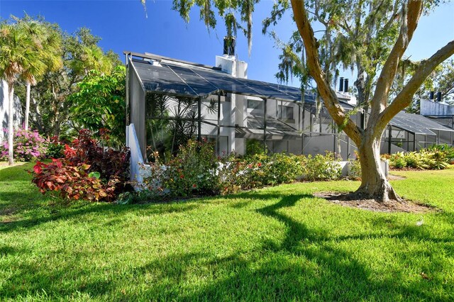 view of yard with a lanai