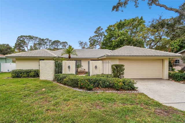 single story home featuring a front yard and a garage