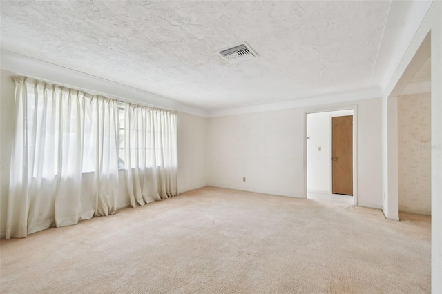 empty room featuring light carpet