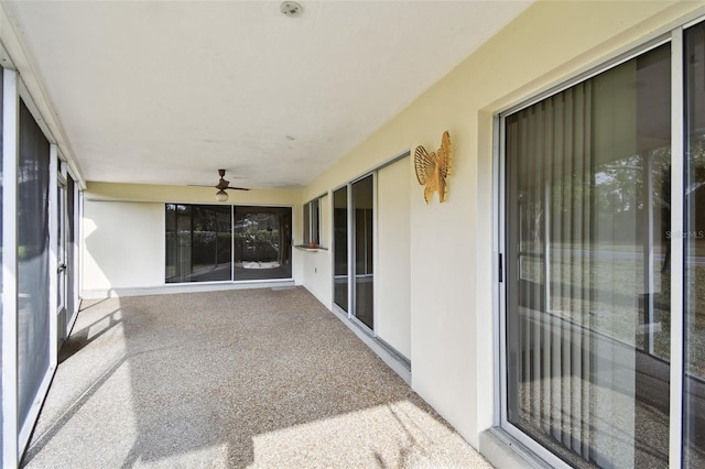 view of patio featuring ceiling fan