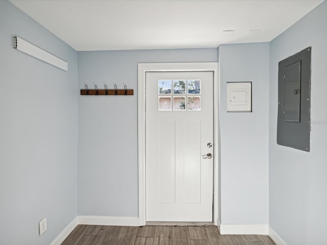 foyer entrance featuring wood-type flooring and electric panel