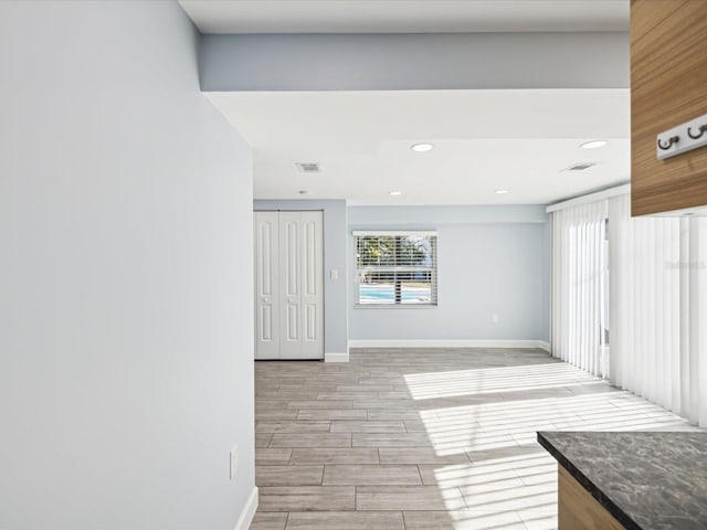 spare room featuring light wood-type flooring