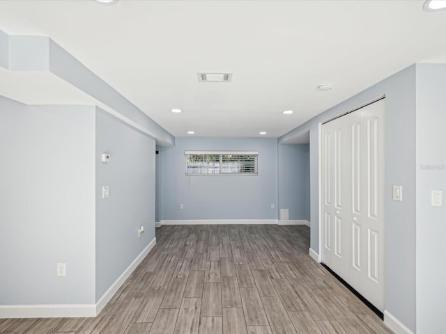 spare room with light wood-type flooring