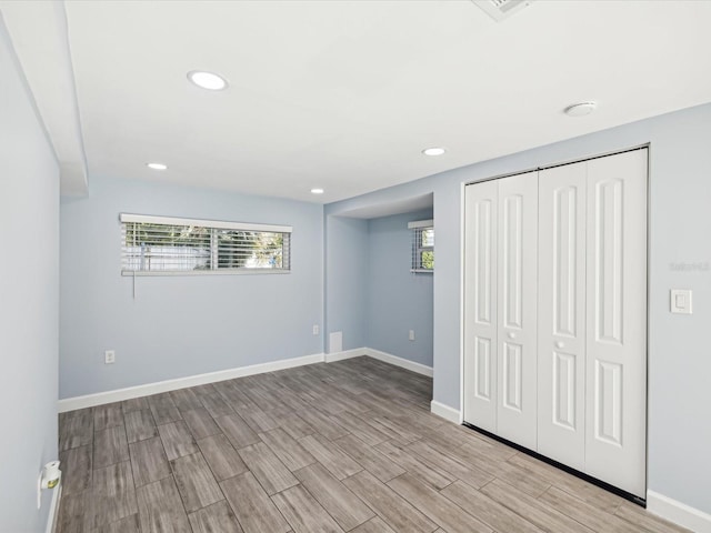 basement featuring light hardwood / wood-style floors