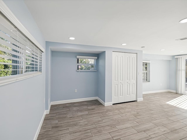 spare room with light wood-type flooring