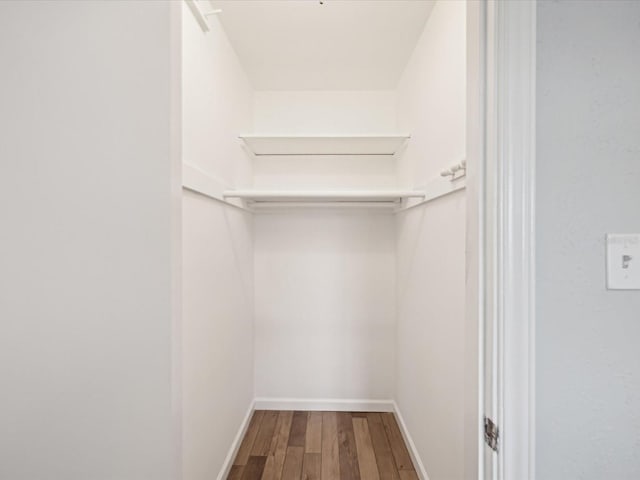 walk in closet featuring hardwood / wood-style floors