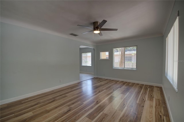 unfurnished room with ceiling fan and hardwood / wood-style floors