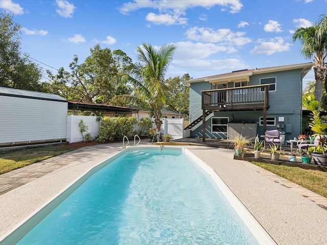 view of pool with a patio and a wooden deck