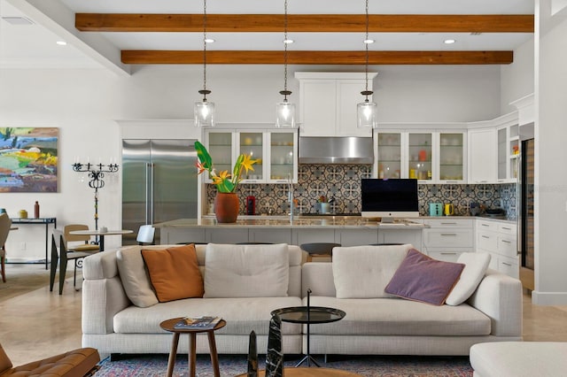 living room featuring beam ceiling