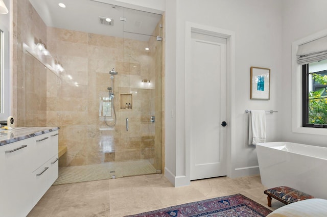 bathroom with vanity and separate shower and tub