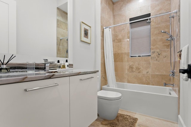 full bathroom featuring tile patterned floors, shower / tub combo with curtain, vanity, and toilet