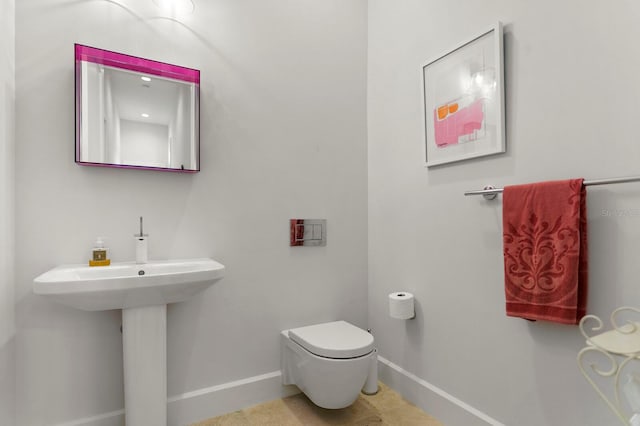 bathroom with sink and toilet