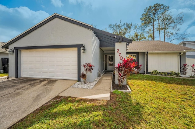 ranch-style house featuring a garage and a front yard